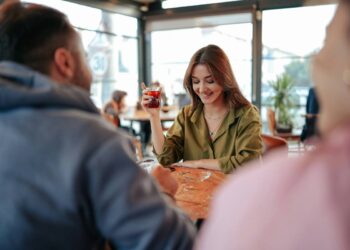 a woman is shy when looking at a man